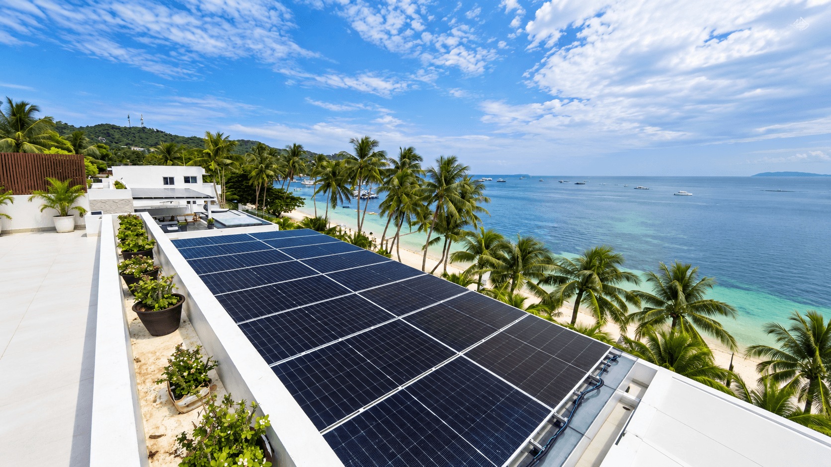 Blue-roofed house with solar panels among palm trees